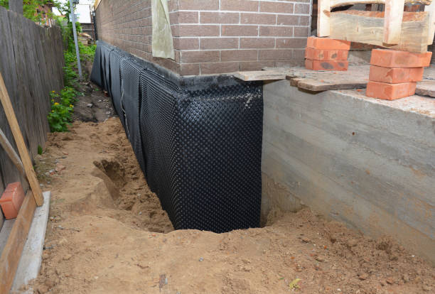 Happy homeowners after waterproofing job in Briggsville